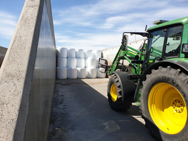 Image shows a tractor moving bales that were used when testing Orkel recycled film